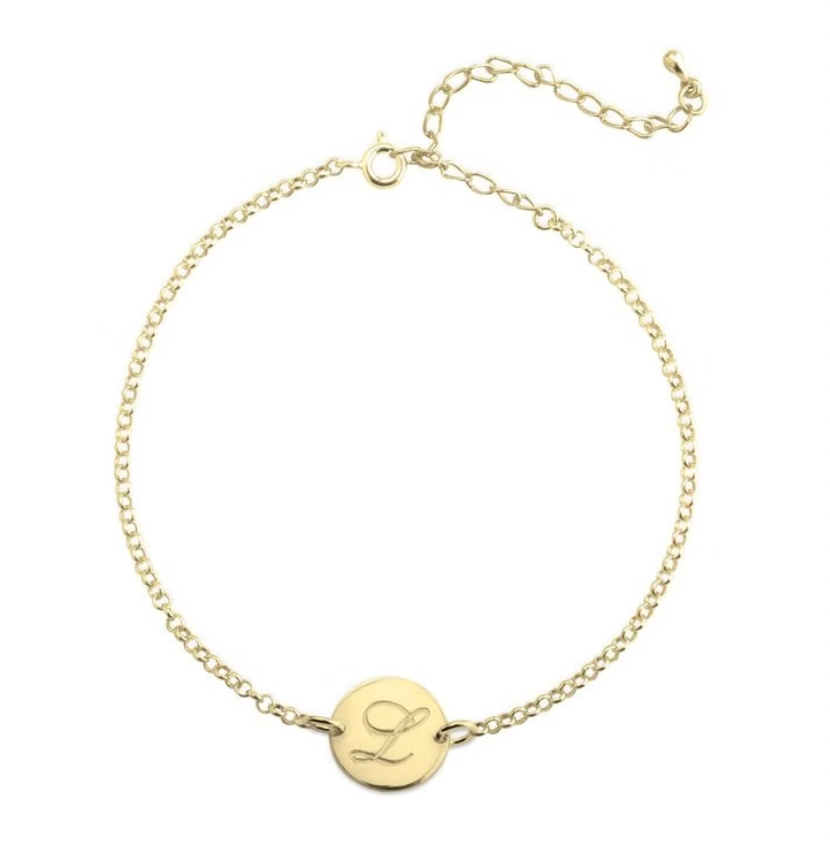 Gold bracelet with a round pendant featuring the letter sterling silver, rose gold, plated. gold. silver. rose gold. plated 18k solid sterling silver. makana jewellery jewelry