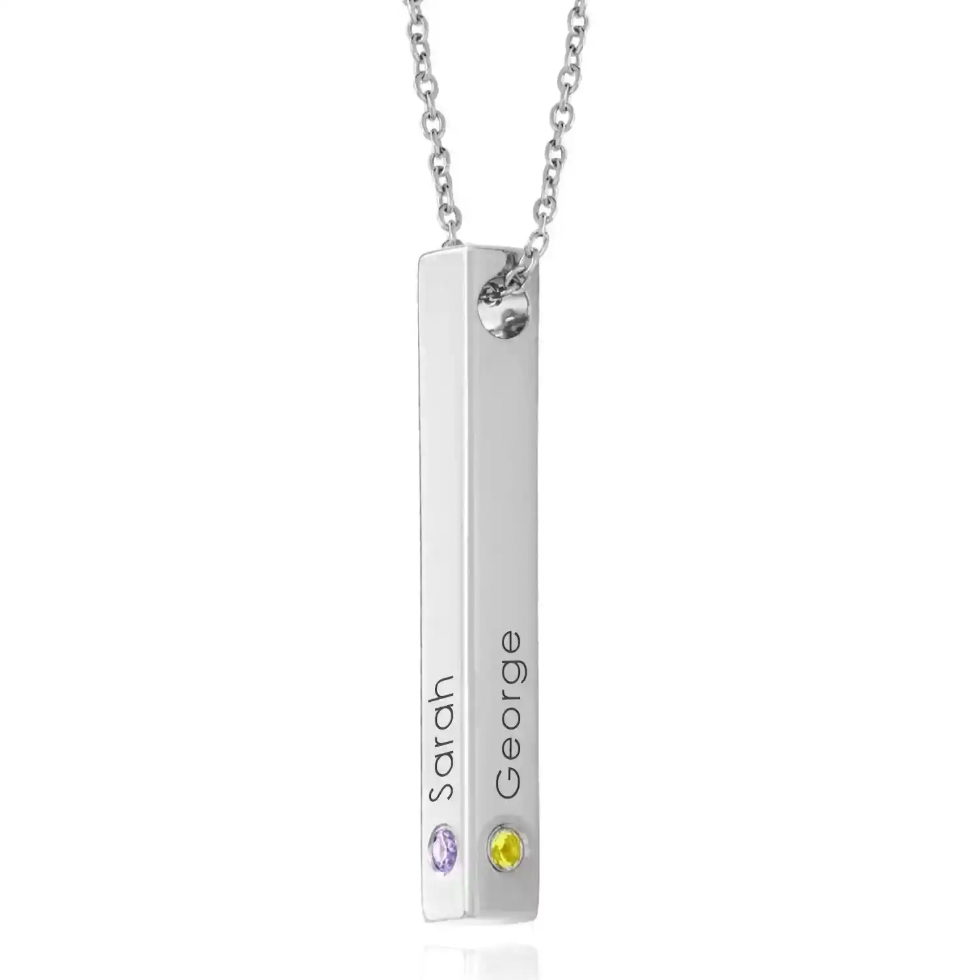 A silver bar necklace with a vertical rectangular pendant engraved with the names  accented with a small purple gemstone and a yellow gemstone at the bottom. gold, gold plated, sterling silver 925. makana jewelry, makana jewellery. personalized jewelry, imitation jewellery