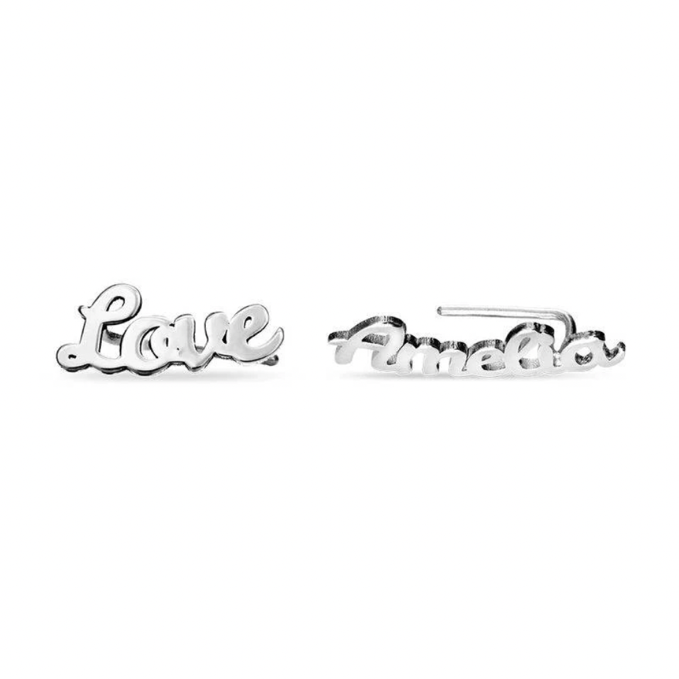 A pair of silver script nameplate earrings spelling. gold, sterling silver 925, rose gold. 18k, 20k. makana jewellery, jewelry