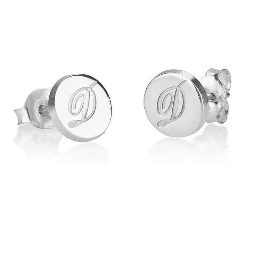 A pair of silver stud earrings with a circular face engraved with a cursive lowercase  monogram. Gold, Rose Gold, Sterling Silver 925, Makana Jewellery, jewelry. gold  plated