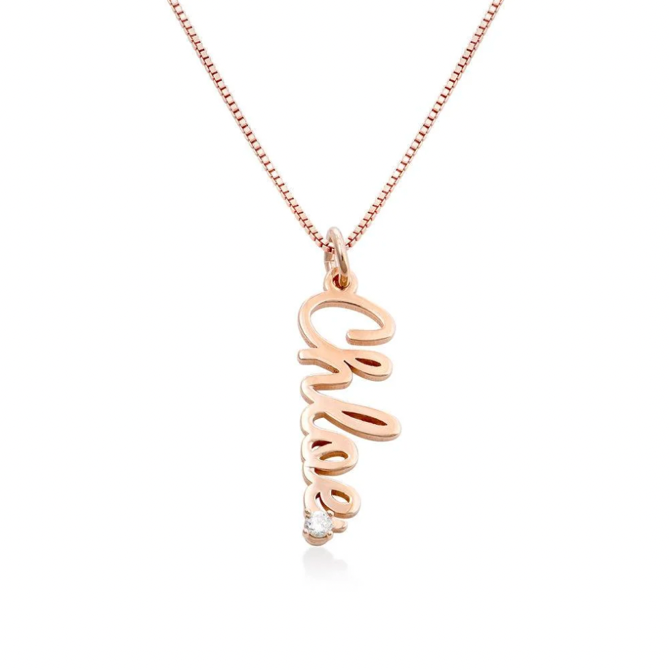 A rose gold script name necklace with a delicate chain and a cursive pendant A rose gold shaped pendant necklace with interlocking curved arms. Diamond, sterling silver 925, gold plated, rose gold plated. makana jewellery, jewelry