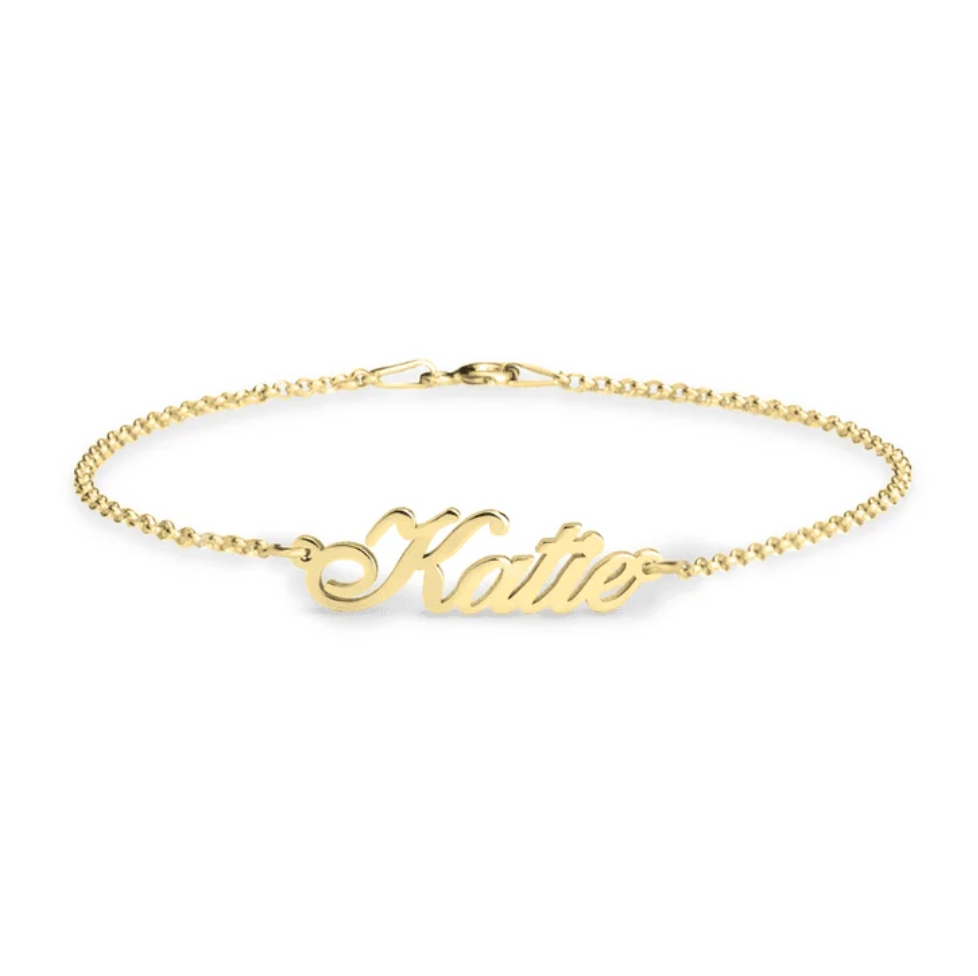 A delicate gold chain bracelet featuring a polished script nameplate that reads. gold plated, rose gold plated, sterling silver 925. makana jewelry, jewellery.