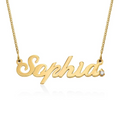 A gold name plate necklace in cursive script, featuring a small clear diamond at the end. Rose gold, sterling silver, plated, makana jewelry, jewellery. gold