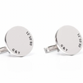 A pair of round silver cufflinks engraved with the initials and the date. Rose gold, sterling silver, plated, makana jewelry, jewellery. gold 