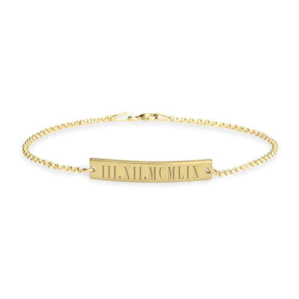 A gold chain bracelet with a central horizontal bar engraved with the Roman numerals 'III, XII, MCMLX',  gold plated, rose gold plated, sterling silver 925. makana jewelry, jewellery.